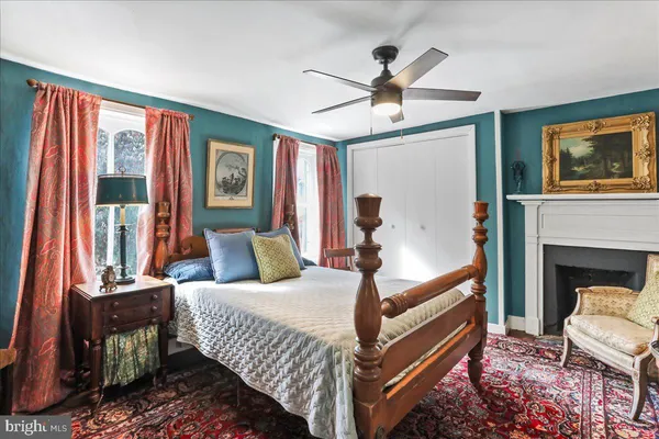 a bedroom with furniture and a bed