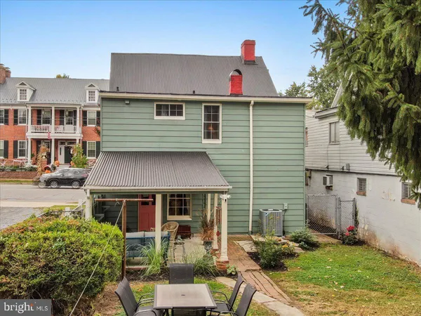 an aerial view of multiple houses with yard