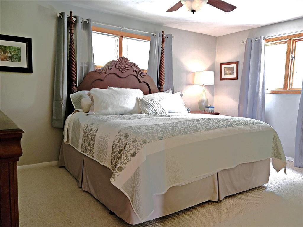 5184 Richland Road Gibsonia, PA 15044 - Photo 11 of 23 a large bed sitting in a bedroom next to a window
