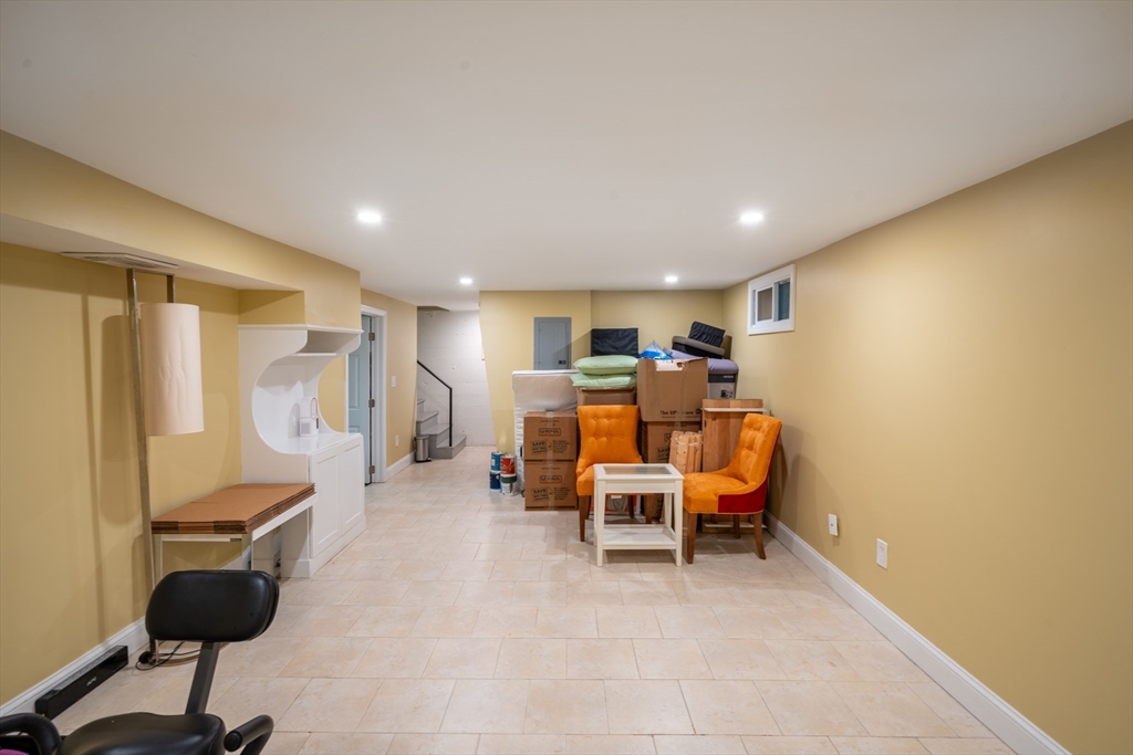 96 Conant Road Weston, MA 02493 - Photo 36 of 42 a room with furniture and a chair