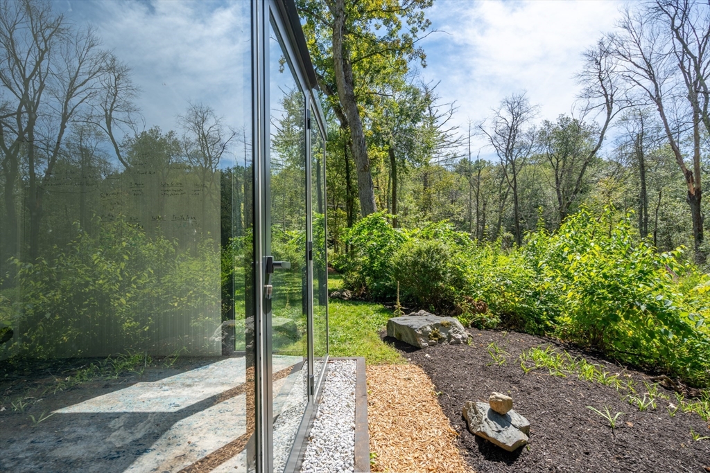 96 Conant Road Weston, MA 02493 - Photo 41 of 42 a view of a backyard with garden