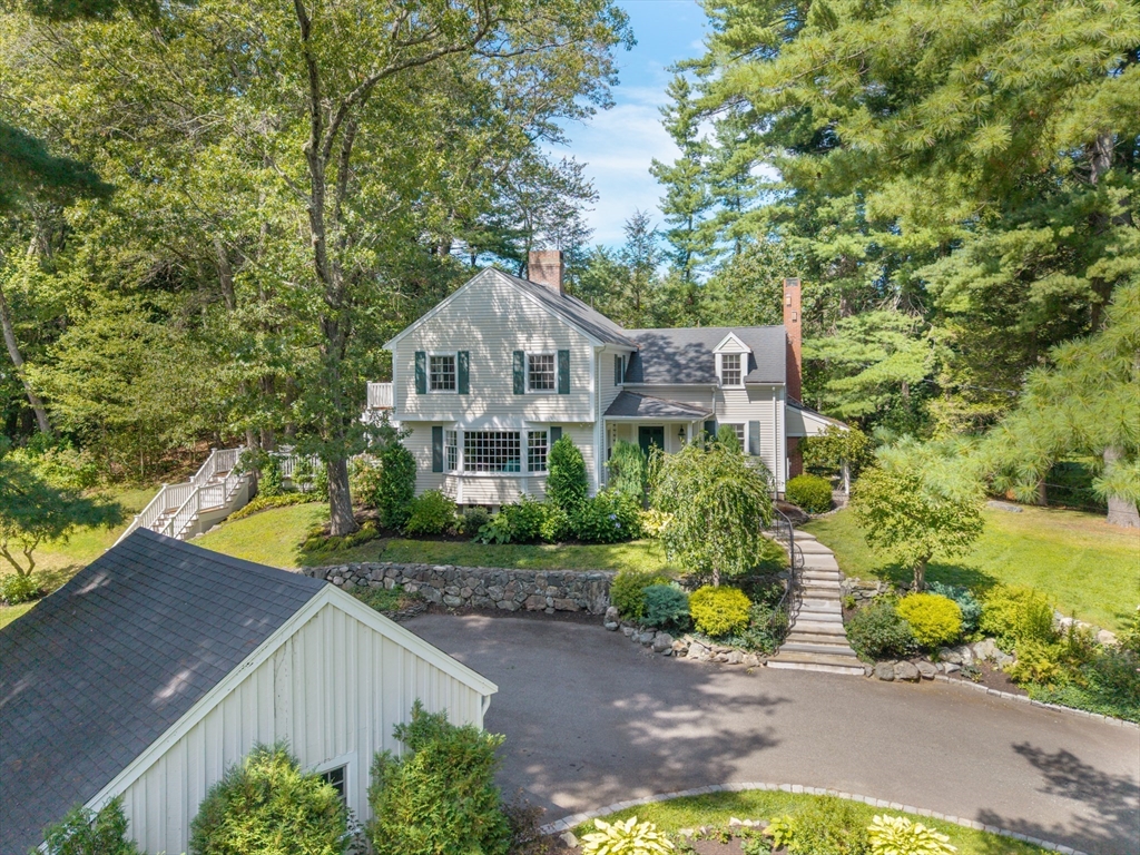 96 Conant Road Weston, MA 02493 - Photo 7 of 42 a view of a house with a yard and large trees
