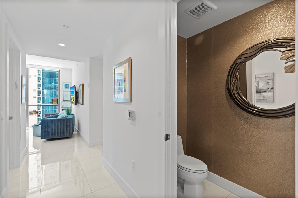 100 East Las Olas Boulevard, Unit 1901 Fort Lauderdale, FL 33301 - Photo 16 of 83 a bathroom with a toilet and a mirror
