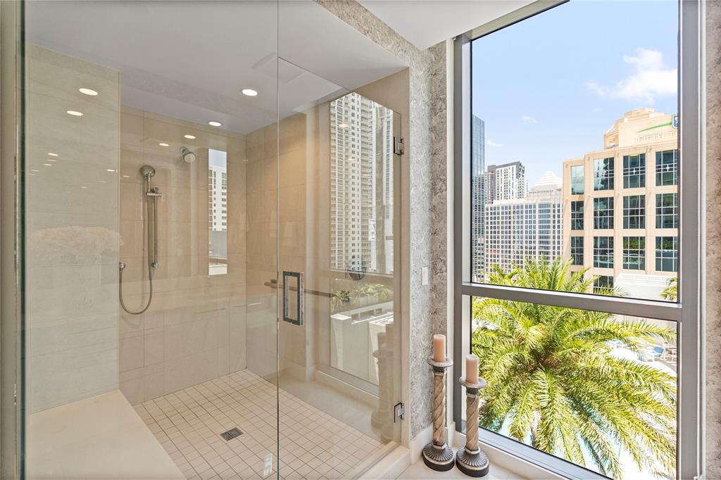 100 East Las Olas Boulevard, Unit 1901 Fort Lauderdale, FL 33301 - Photo 23 of 83 a bathroom with a glass shower door