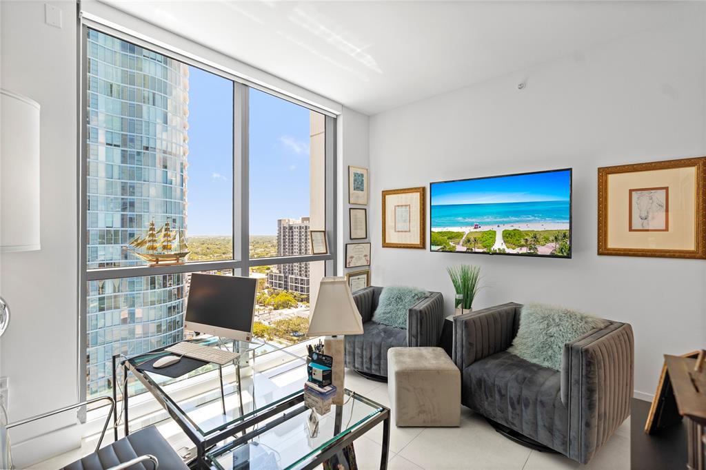 100 East Las Olas Boulevard, Unit 1901 Fort Lauderdale, FL 33301 - Photo 27 of 83 a living room with furniture and a floor to ceiling window