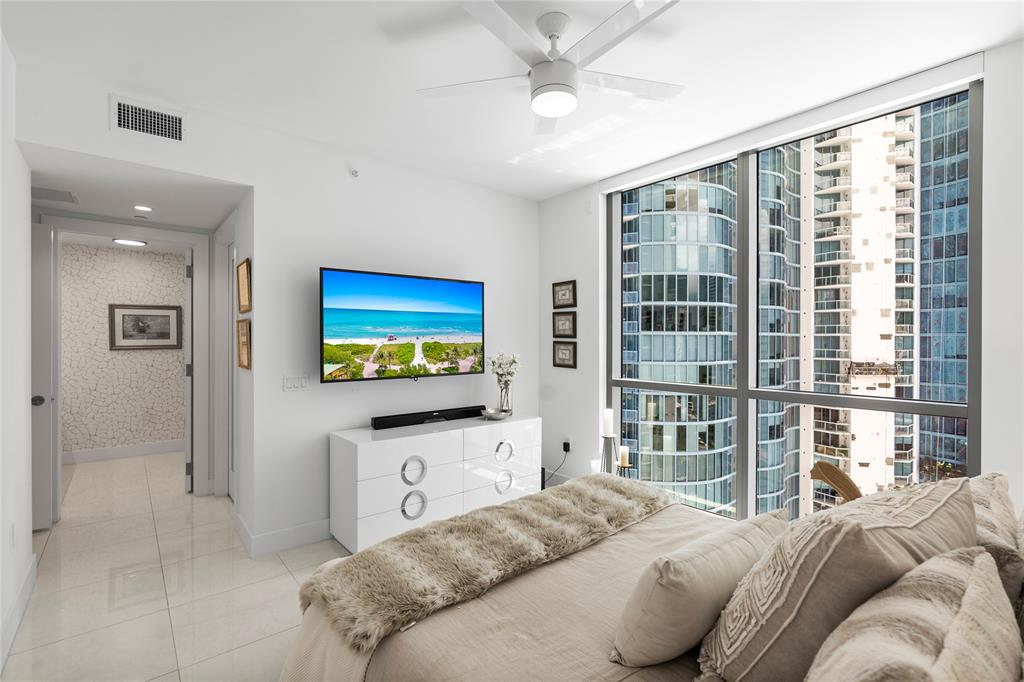 100 East Las Olas Boulevard, Unit 1901 Fort Lauderdale, FL 33301 - Photo 32 of 83 a bedroom with a bed and a flat screen tv