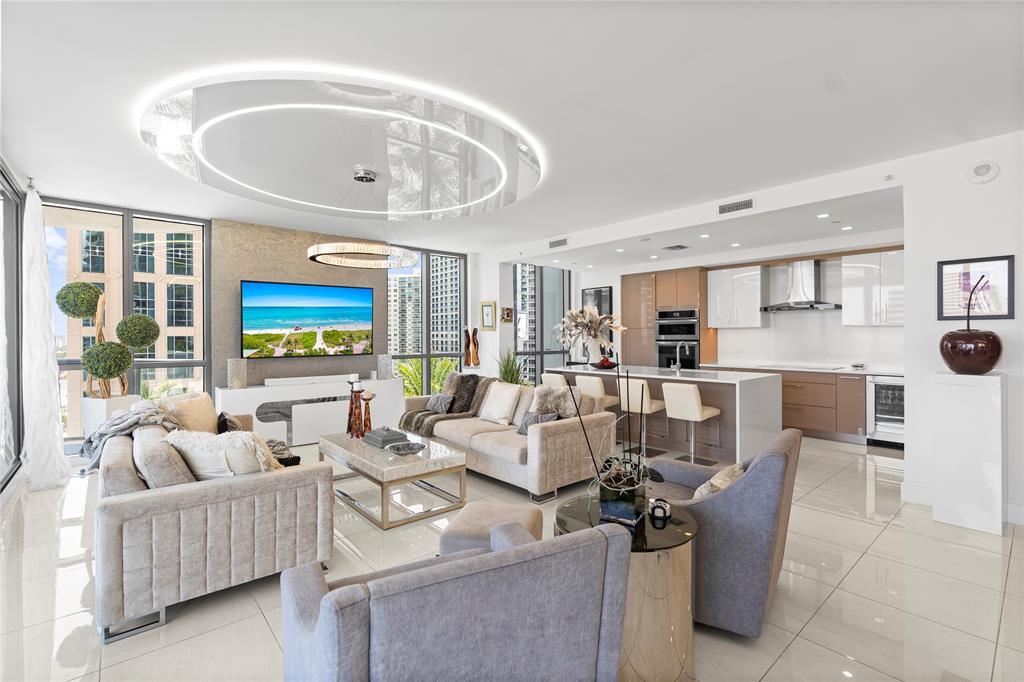 100 East Las Olas Boulevard, Unit 1901 Fort Lauderdale, FL 33301 - Photo 6 of 83 a living room with furniture and a large window