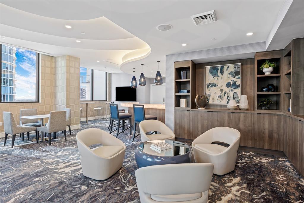 100 East Las Olas Boulevard, Unit 1901 Fort Lauderdale, FL 33301 - Photo 74 of 83 a living room with furniture a large window and a fireplace