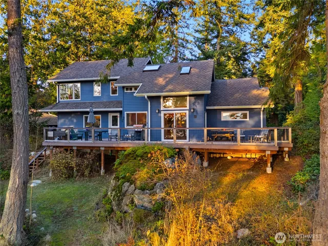 a house with lots of trees in the background