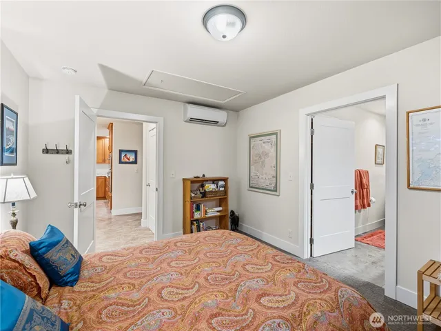 a bedroom with a bed and closet