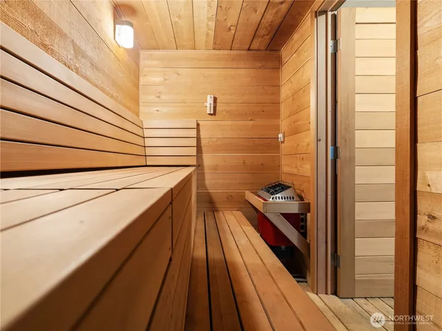 a bathroom with a sink and wooden floor