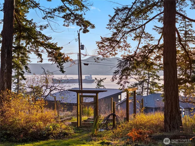 a view of a house with a yard and fountain