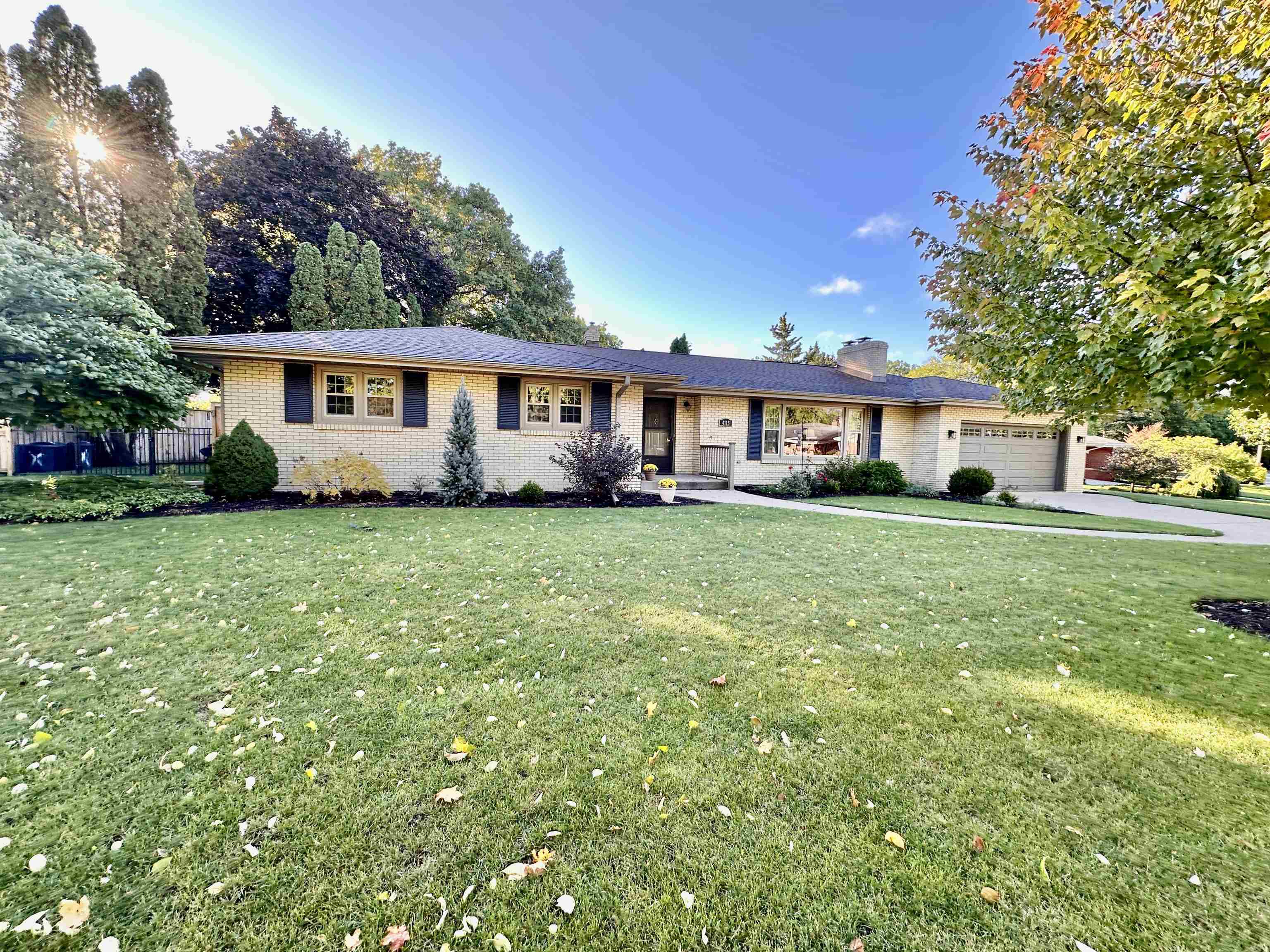 4115 Landstrom Road Rockford, IL 61114 - Photo 1 of 45 a view of a house with a big yard and potted plants