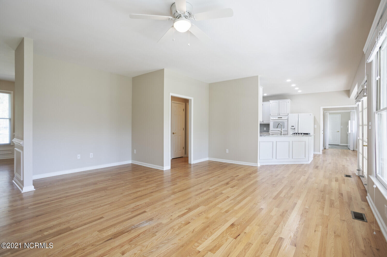1228 Liberty Landing Road Southeast Winnabow, NC 28479 - Photo 12 of 94 Family Room has refinished hardwood floors