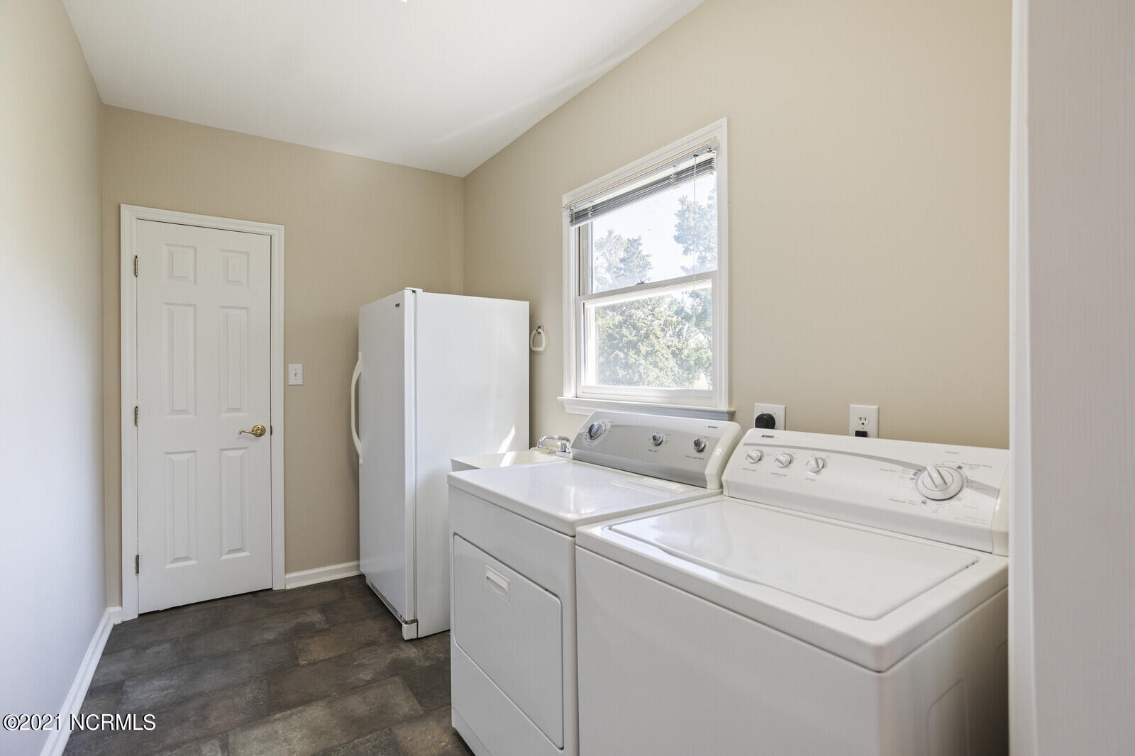 1228 Liberty Landing Road Southeast Winnabow, NC 28479 - Photo 29 of 94 Laundry room & door to storage room