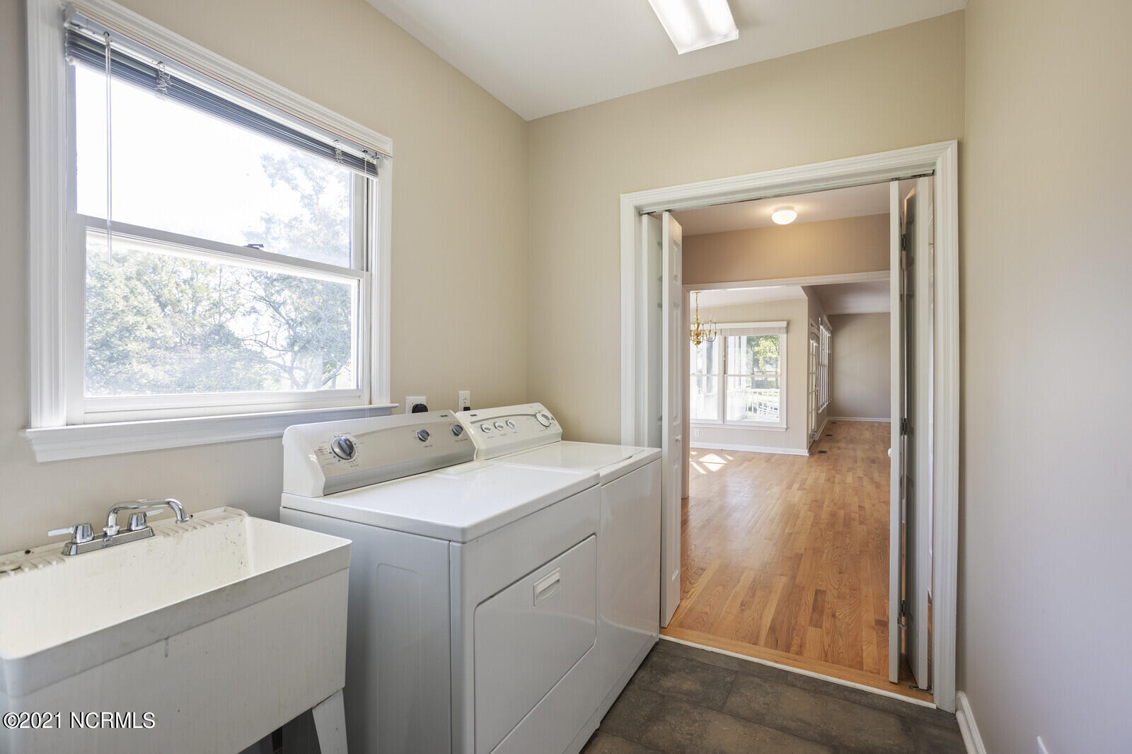 1228 Liberty Landing Road Southeast Winnabow, NC 28479 - Photo 30 of 94 Laundry room has a utility sink.