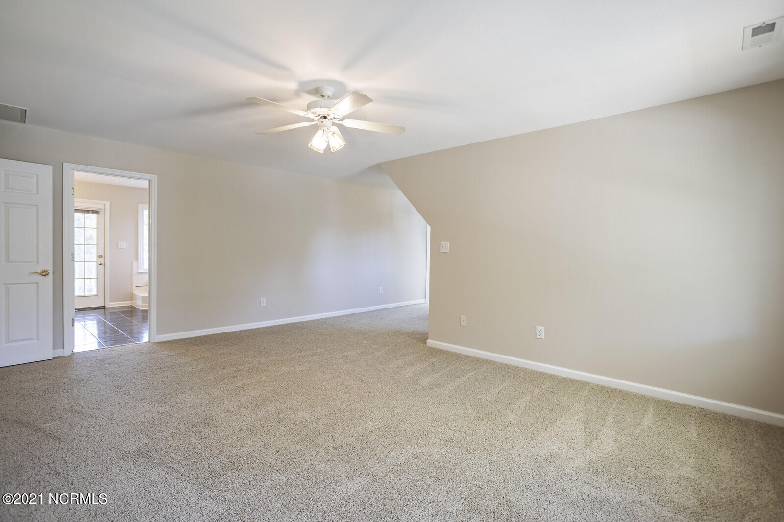 1228 Liberty Landing Road Southeast Winnabow, NC 28479 - Photo 39 of 94 Master bedroom & doorway to master bath.