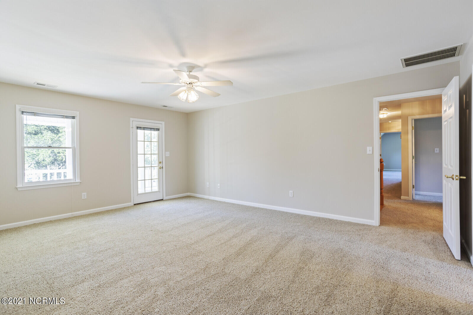 1228 Liberty Landing Road Southeast Winnabow, NC 28479 - Photo 40 of 94 Master bedroom has a French door to the balcony.