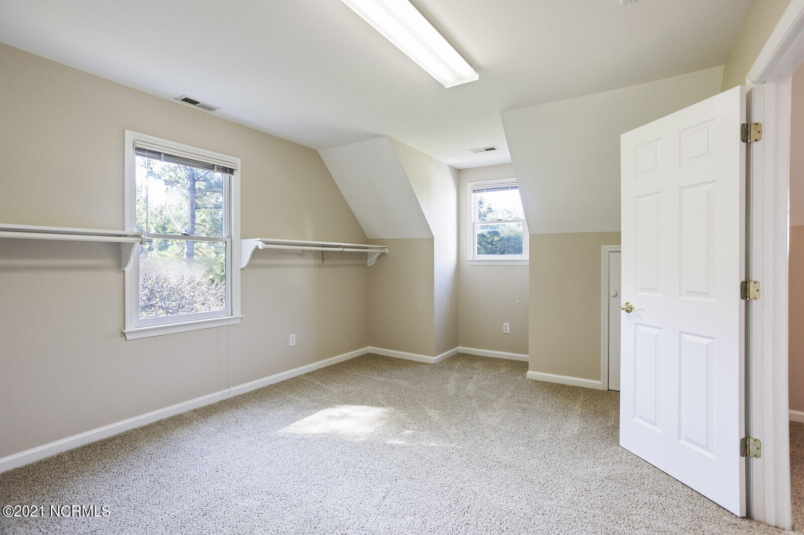 1228 Liberty Landing Road Southeast Winnabow, NC 28479 - Photo 42 of 94 Huge walk in closet in Master has eave storage as well.