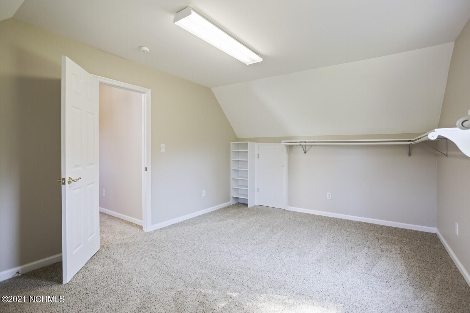 1228 Liberty Landing Road Southeast Winnabow, NC 28479 - Photo 43 of 94 Huge walk in closet in Master has eave storage as well.