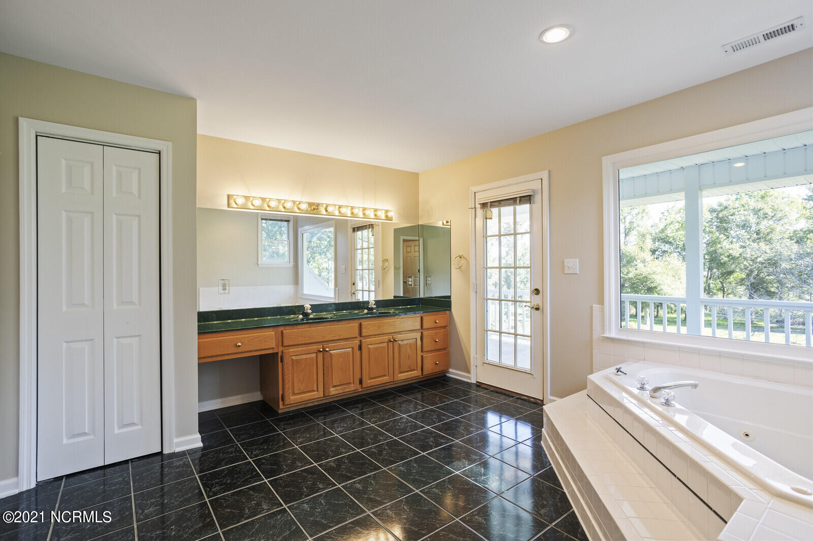 1228 Liberty Landing Road Southeast Winnabow, NC 28479 - Photo 45 of 94 Master bath has large vanity with 2 sinks & linen closet. French door to balcony.