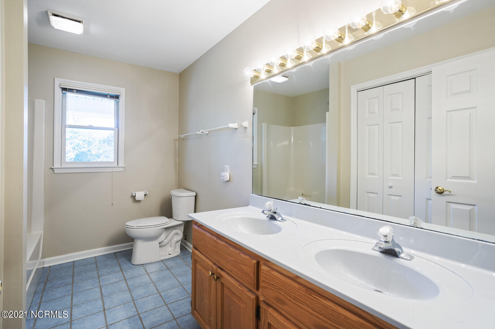1228 Liberty Landing Road Southeast Winnabow, NC 28479 - Photo 53 of 94 3rd full bath has 2 sinks, linen closet and tub/shower - 2nd floor