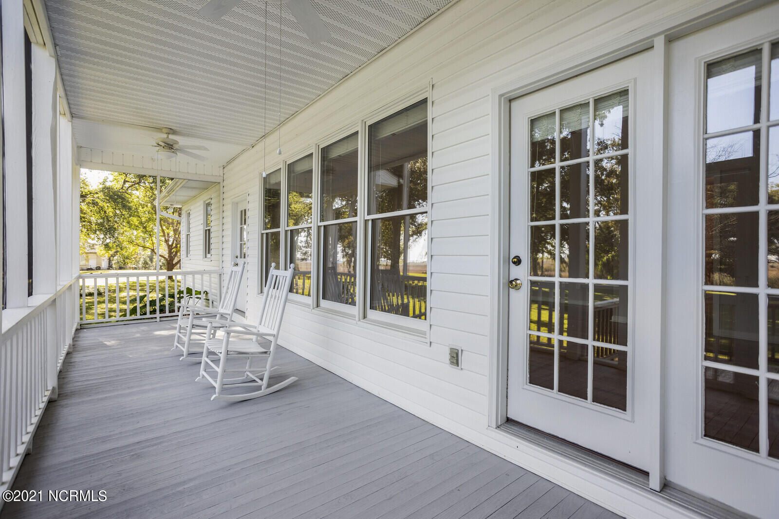 1228 Liberty Landing Road Southeast Winnabow, NC 28479 - Photo 66 of 94 Screened Porch overlooking the back yard with river views in the distance - first floor