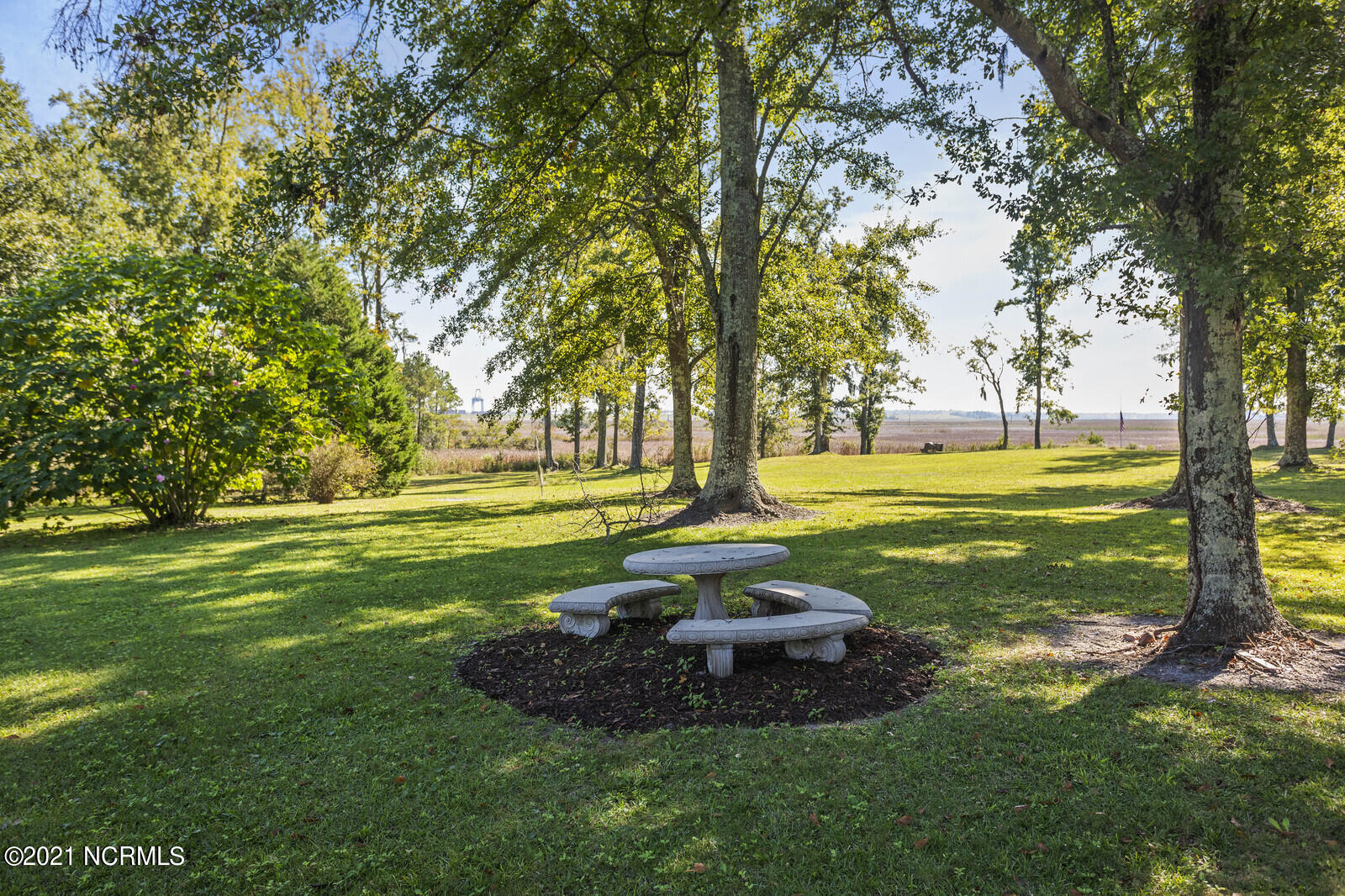 1228 Liberty Landing Road Southeast Winnabow, NC 28479 - Photo 75 of 94 Concrete table and benches.