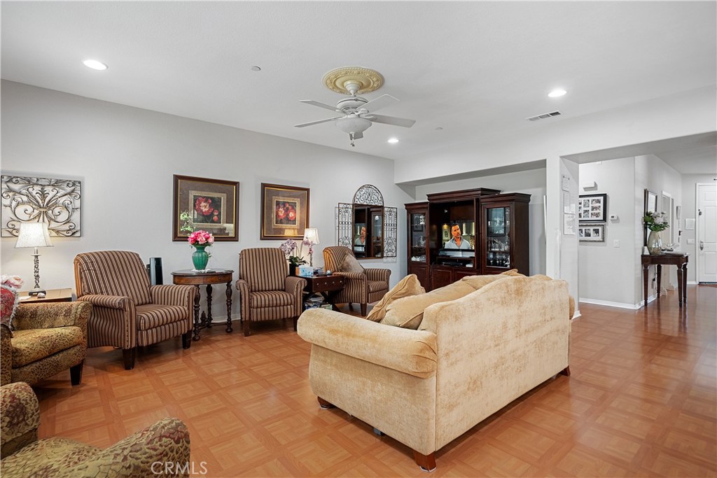 33391 Agate Street Menifee, CA 92584 - Photo 11 of 38 a living room with furniture and a wooden floor