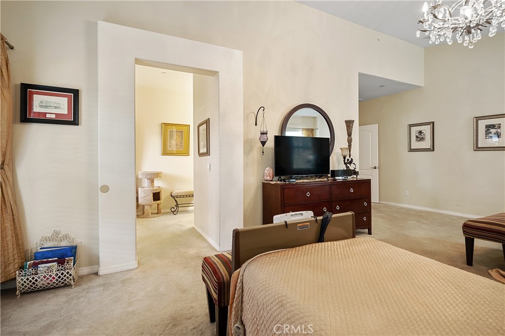 33391 Agate Street Menifee, CA 92584 - Photo 19 of 38 a bedroom with a bed and a flat screen tv