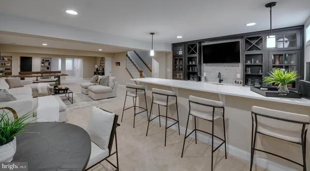 a very nice looking living room with furniture and a flat screen tv