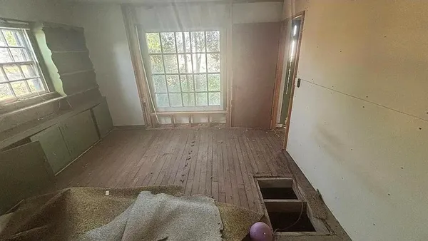 an entryway with wooden floor