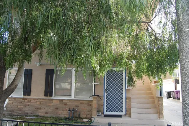 front view of a house with a garden