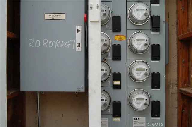 a view of an empty room with wooden floor and closet