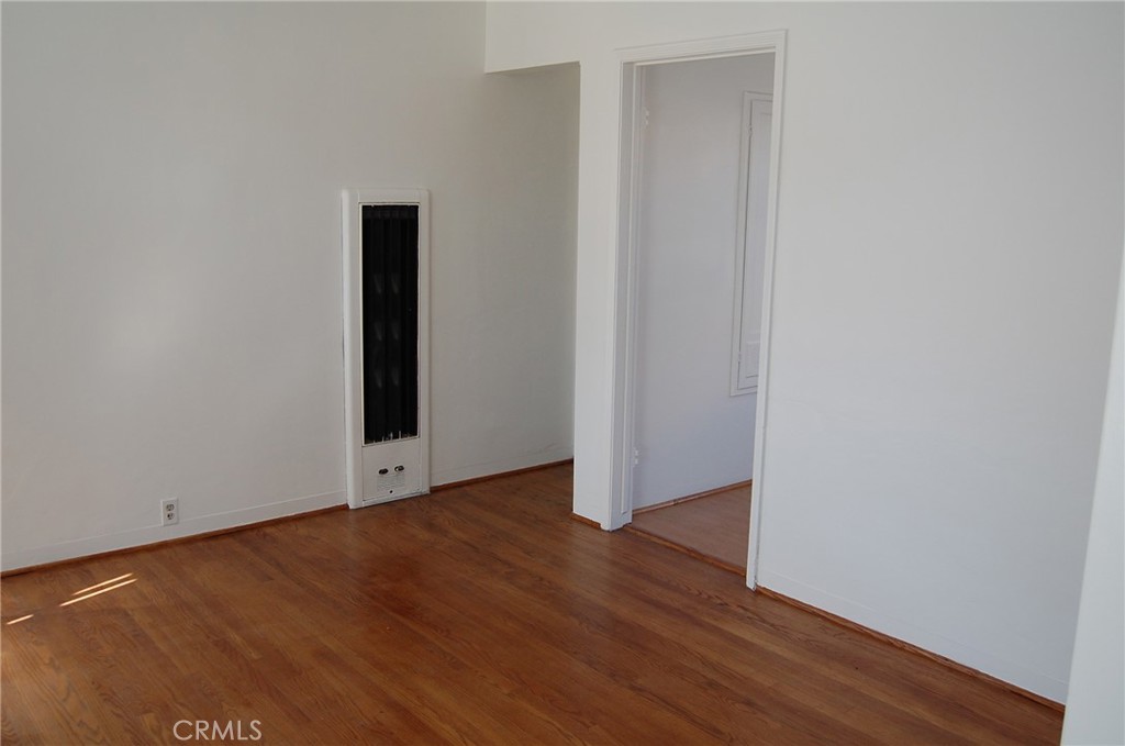 20 Roycroft Avenue Long Beach, CA 90803 - Photo 20 of 22 a view of an empty room with wooden floor and closet