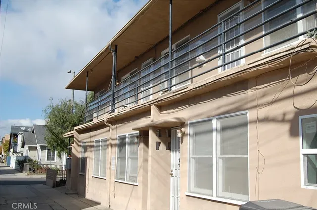 a view of building with green space and windows