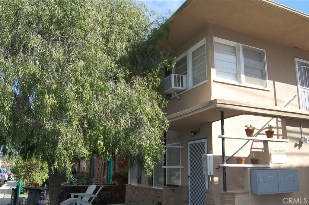 20 Roycroft Avenue Long Beach, CA 90803 - Photo 9 of 22 a view of building with green space and windows