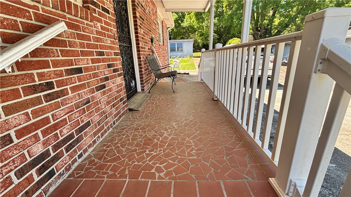 270 Flat Rock Road Liberty, SC 29657 - Photo 12 of 18 This inviting porch, featuring a brick exterior and a patterned tile floor, provides a charming entry.