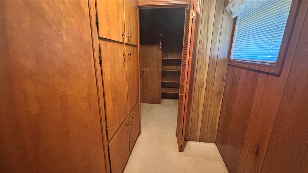 270 Flat Rock Road Liberty, SC 29657 - Photo 13 of 18 This closet features ample storage and a charming window, providing both utility and natural light.