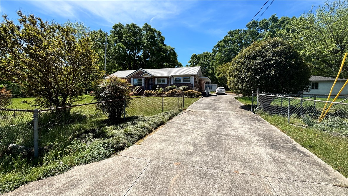 270 Flat Rock Road Liberty, SC 29657 - Photo 2 of 18 This charming home features a classic brick exterior and a durable metal roof.