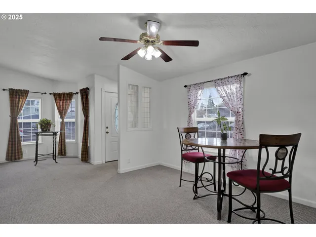 a view of a livingroom with furniture window and wooden floor