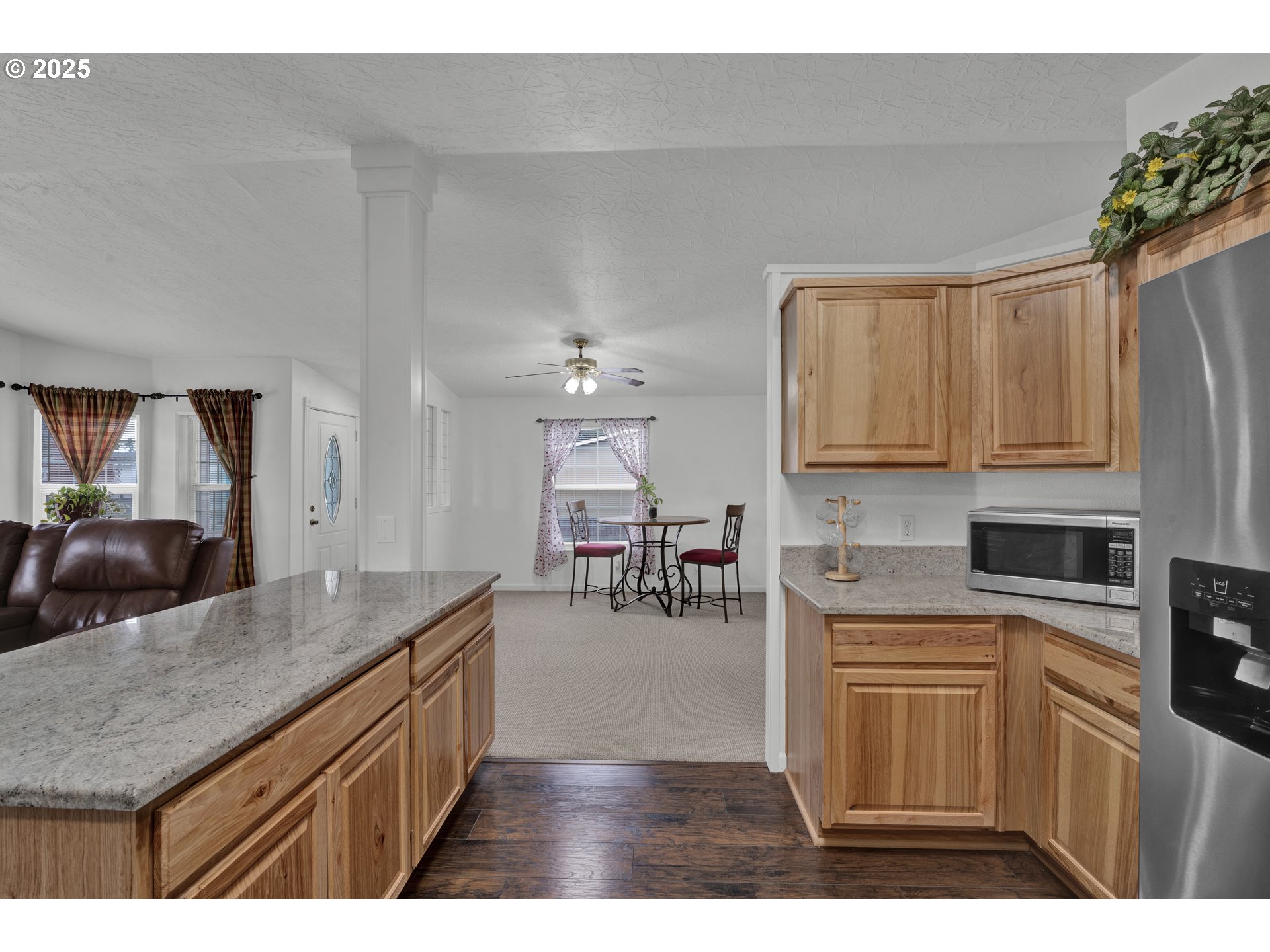 346 East 10th Place Junction City, OR 97448 - Photo 16 of 39 a kitchen with cabinets and chairs