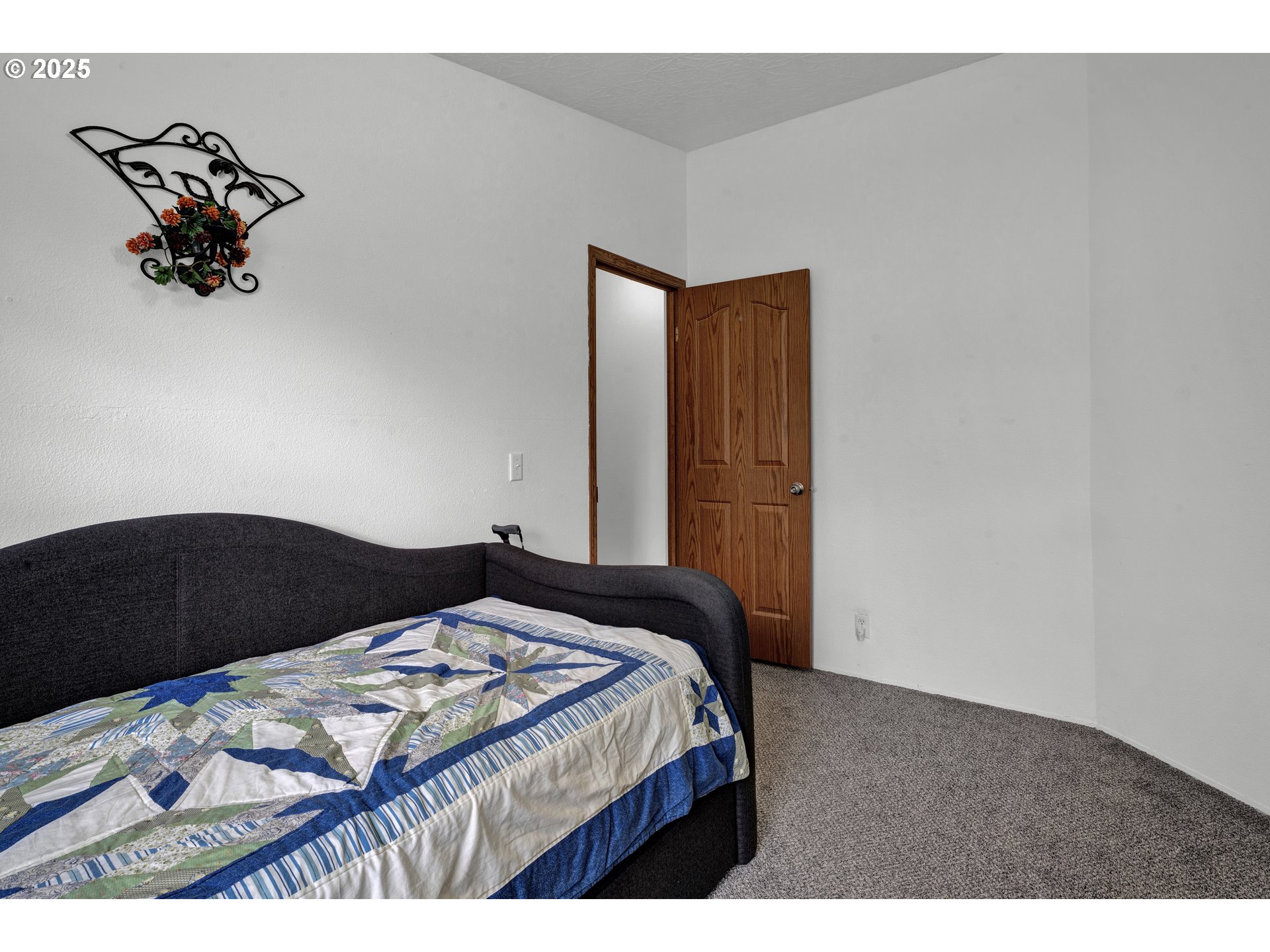 346 East 10th Place Junction City, OR 97448 - Photo 22 of 39 a bedroom with a bed and a dresser