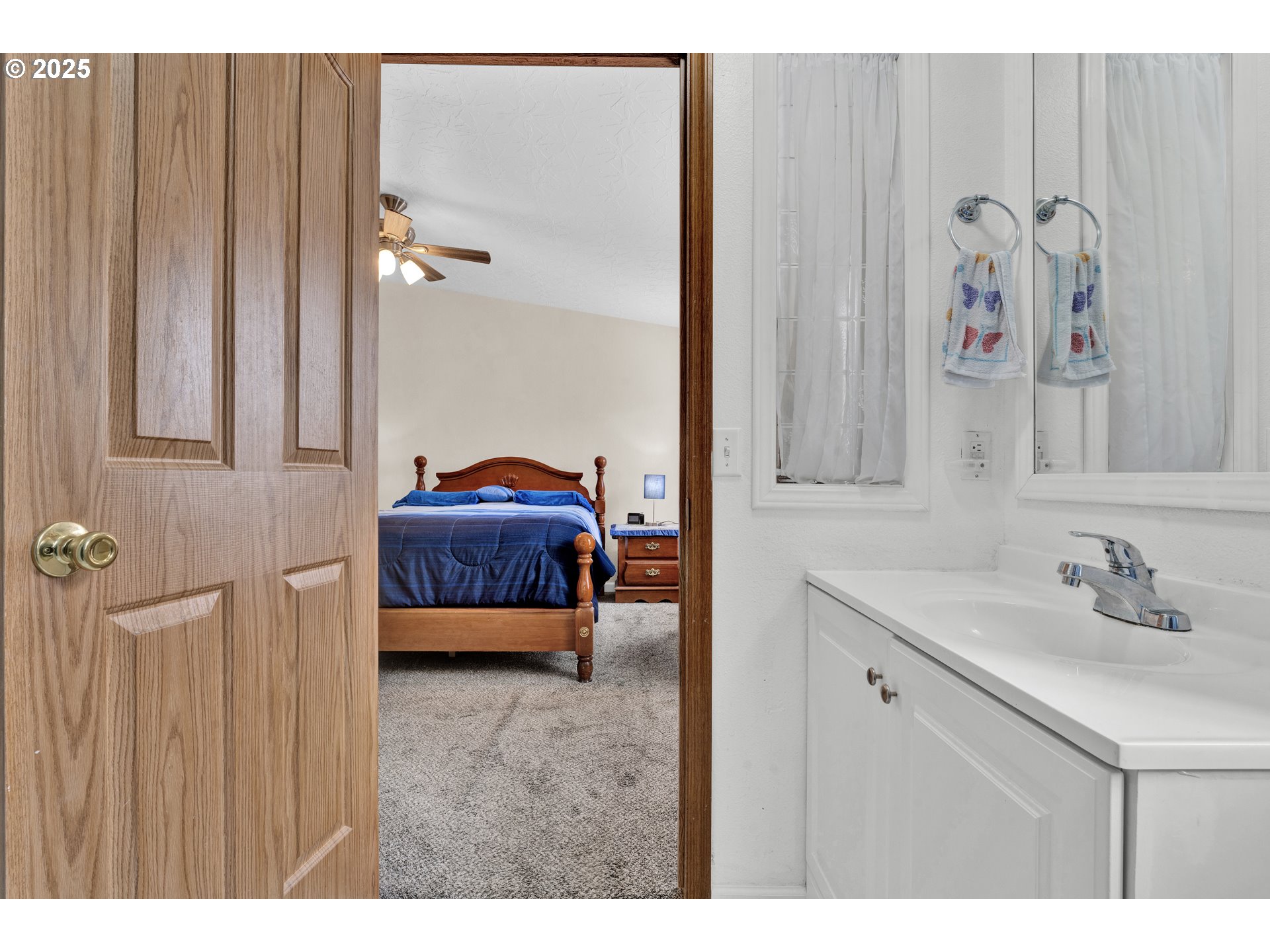 346 East 10th Place Junction City, OR 97448 - Photo 31 of 39 a bedroom with a bed and a mirror