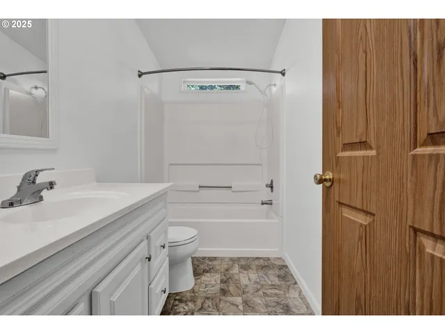 a bathroom with a sink a mirror and a vanity