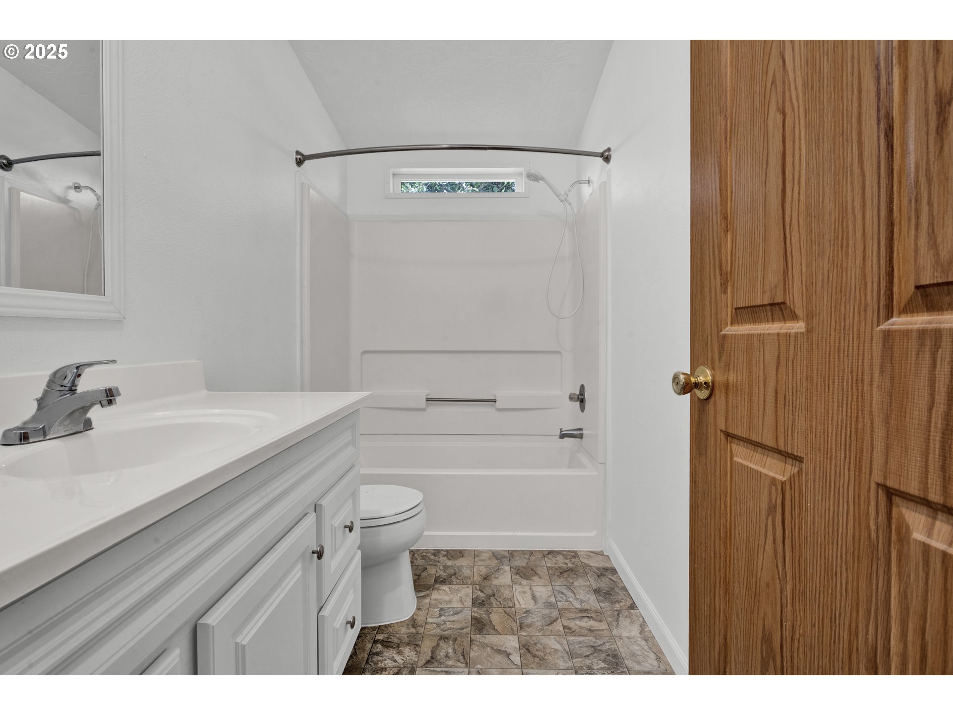 346 East 10th Place Junction City, OR 97448 - Photo 32 of 39 a bathroom with a sink a toilet and shower