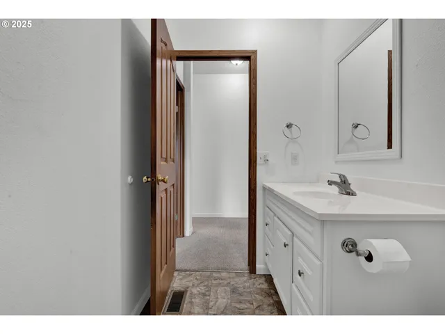 a backyard of a house with yard and barbeque oven