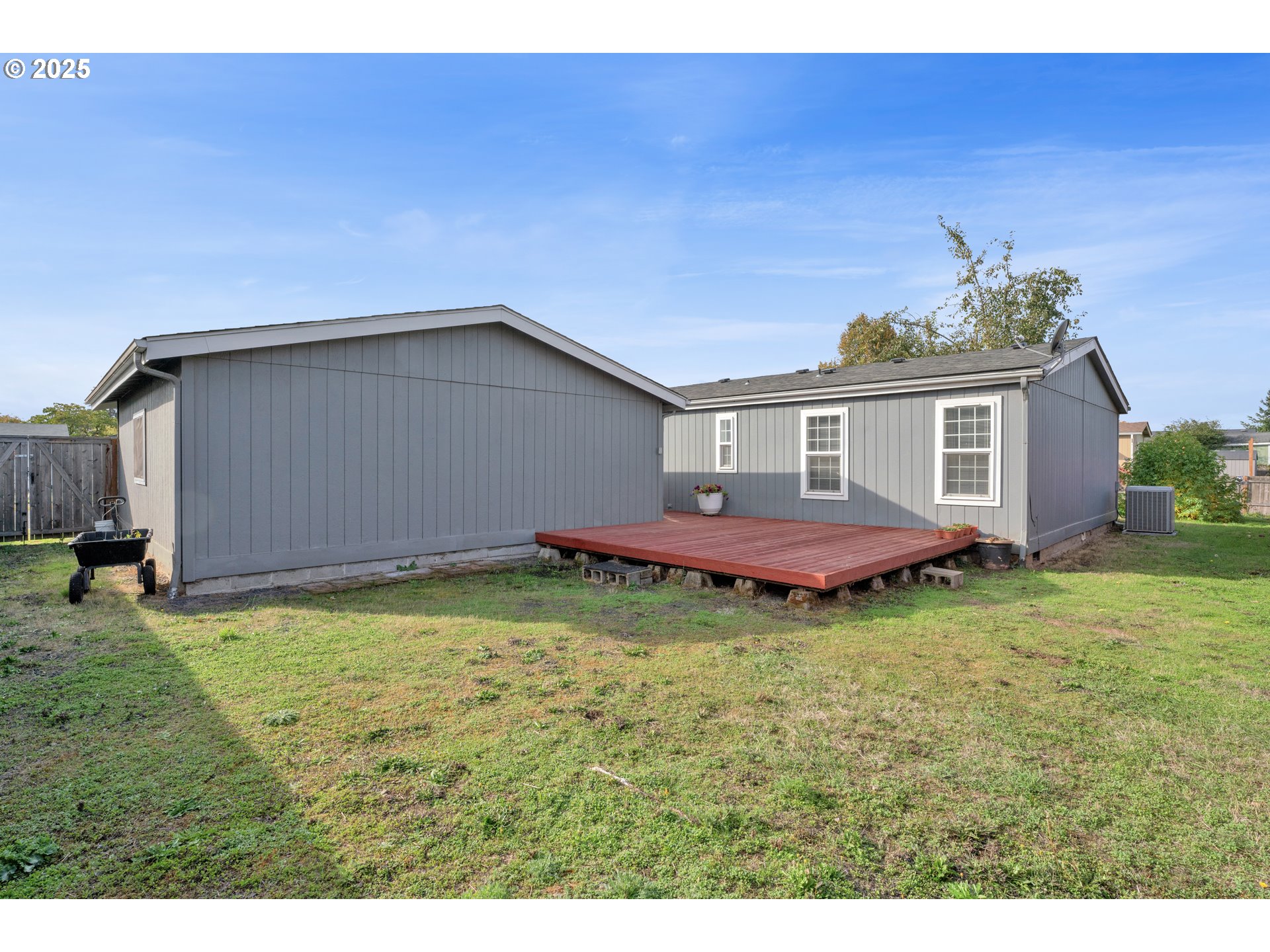 346 East 10th Place Junction City, OR 97448 - Photo 34 of 39 a backyard of a house with yard and barbeque oven