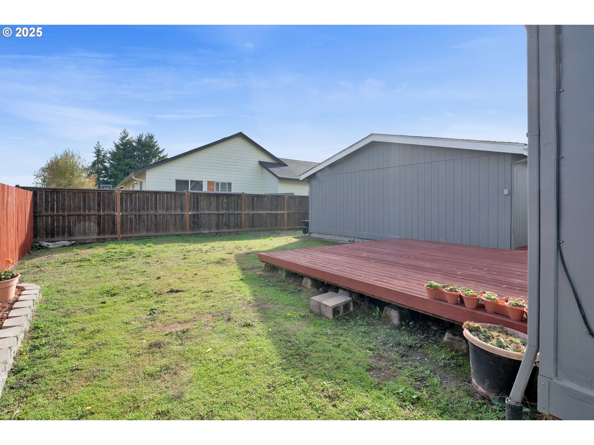 346 East 10th Place Junction City, OR 97448 - Photo 35 of 39 a view of a backyard with a small cabin