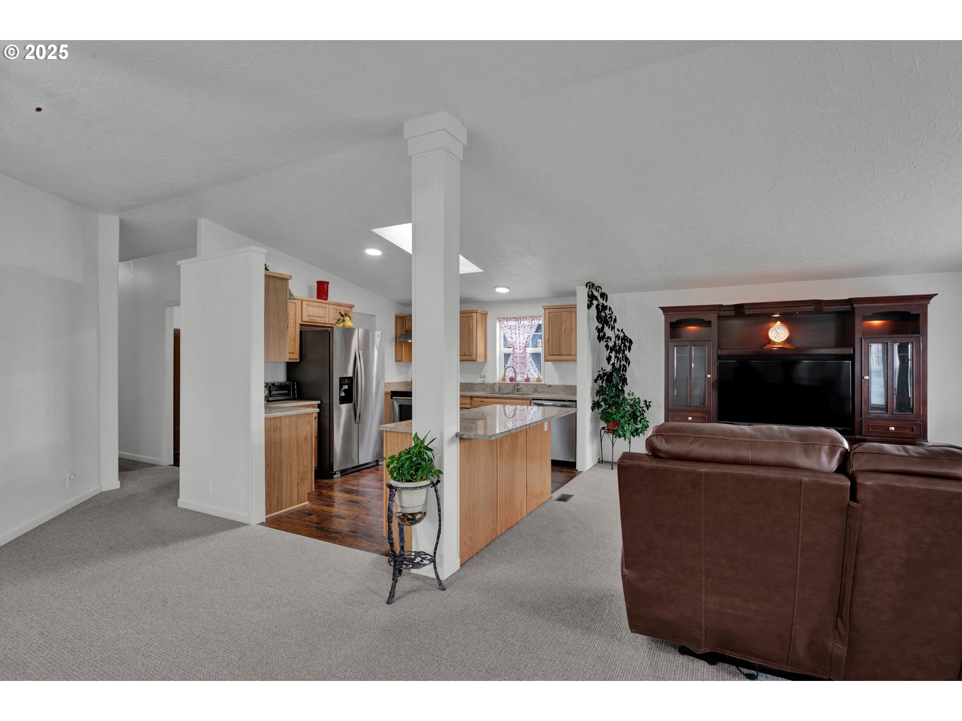 346 East 10th Place Junction City, OR 97448 - Photo 5 of 39 a living room with furniture and a flat screen tv